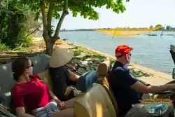 Passengers enjoying the Vietnamese countryside in a Citroën La Dalat classic car – Hoi An tour